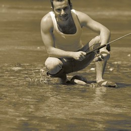 Photo of a Man fishing in a river